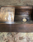 Aged Copper Patina farmhouse sink with flat grid