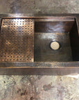 Aged Copper Patina farmhouse sink with flat grid