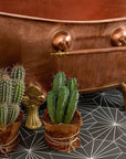 clawfoot copper bathtub with towel rack