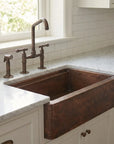 Aged Copper Patina farmhouse sink with flat grid