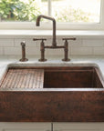Aged Copper Patina farmhouse sink with flat grid