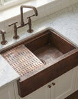 Aged Copper Patina farmhouse sink with flat grid