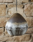 Close-up of the textured oxidized finish on a copper dome pendant