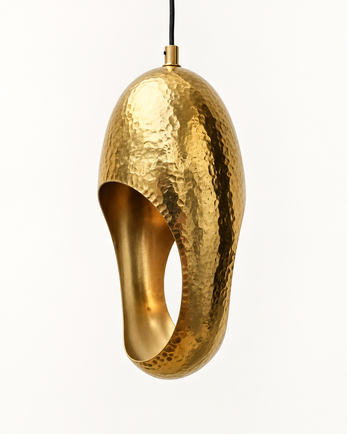 Hammered solid brass sculptural pendant light on a clean studio background