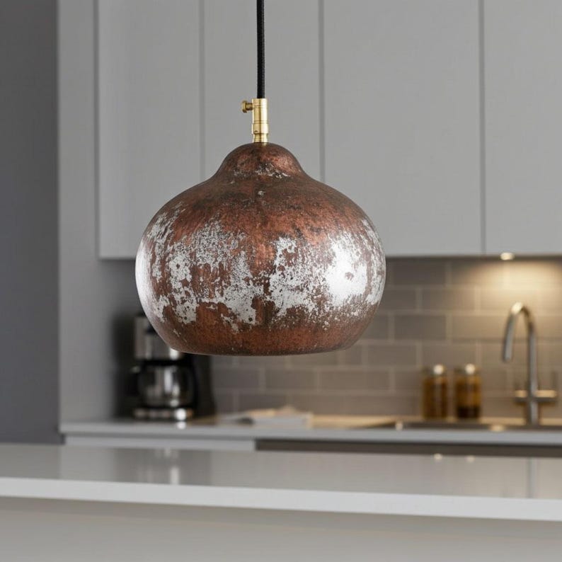 Aged-copper dome pendant light in a contemporary kitchen