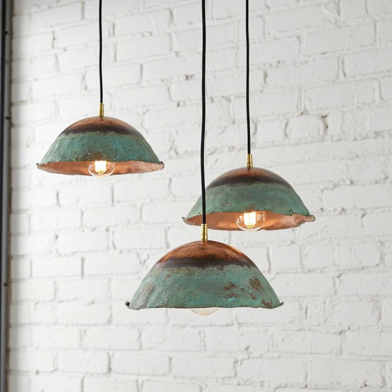 Set of three green patina copper dome pendant lights