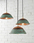 Set of three green patina copper dome pendant lights
