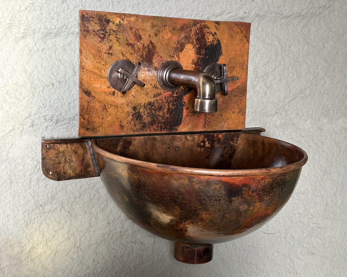 Detailed view of handcrafted hammered copper wall-mount sink